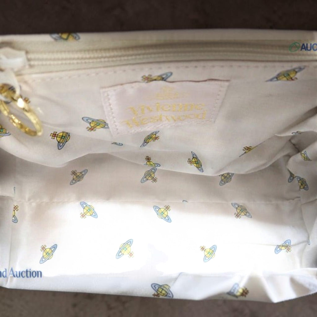 CURATED by Kira Vivienne Westwood black enamel handbag interior featuring branded fabric lining with orb logo pattern