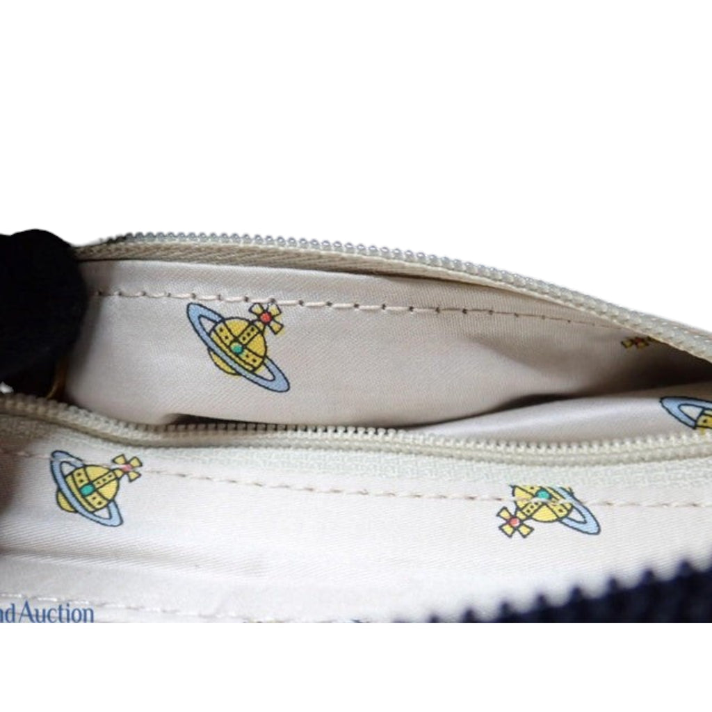 CURATED by Kira Vivienne Westwood enamel handbag interior lining featuring the iconic orb logo print in beige