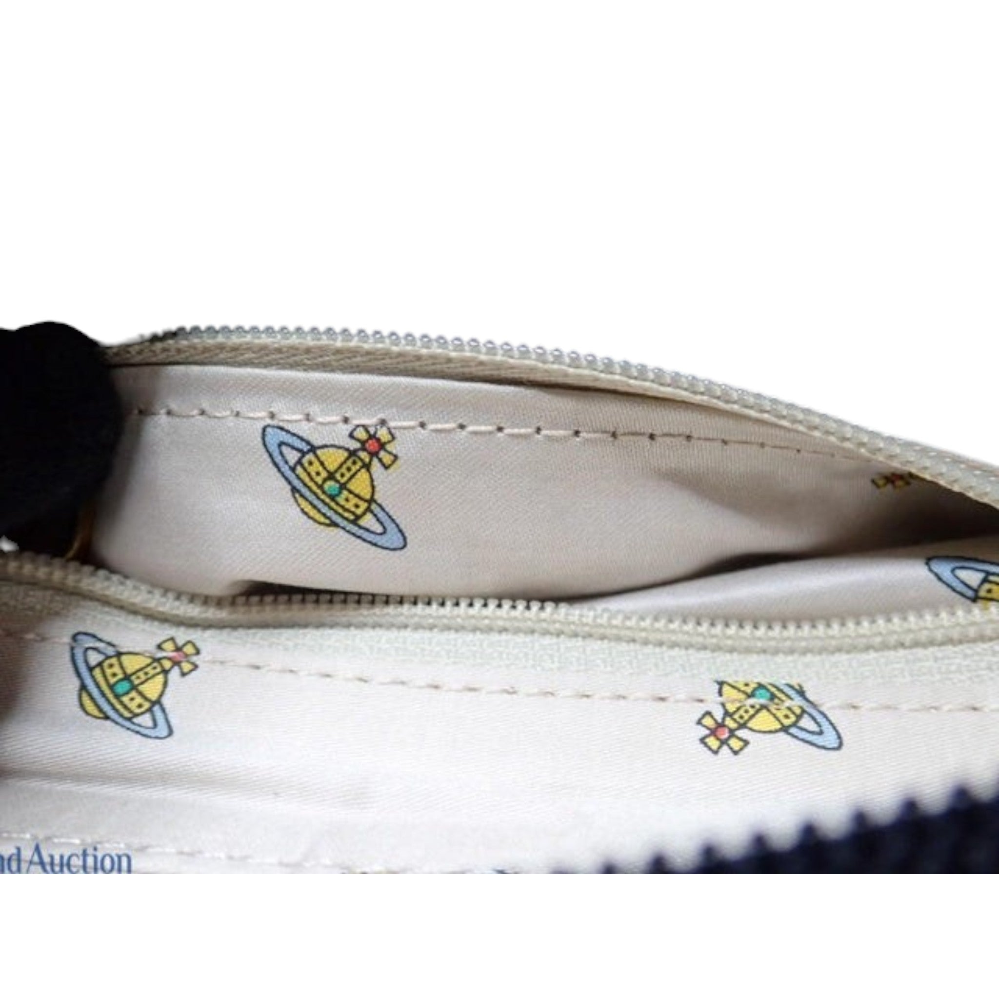 CURATED by Kira Vivienne Westwood enamel handbag interior lining featuring the iconic orb logo print in beige
