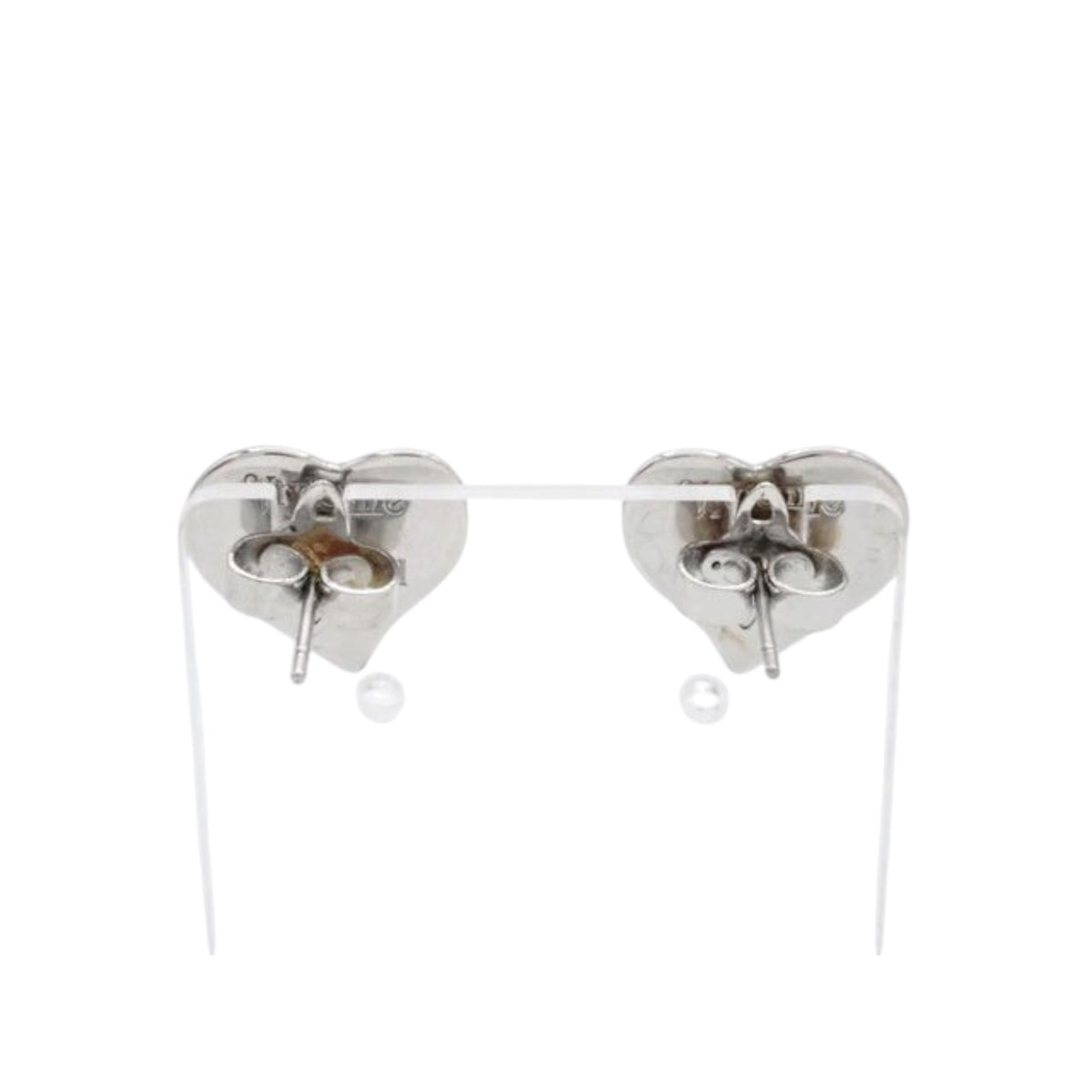 CURATED by Kira Vivienne Westwood silver heart-shaped stud earrings, back view showing post and butterfly backs.