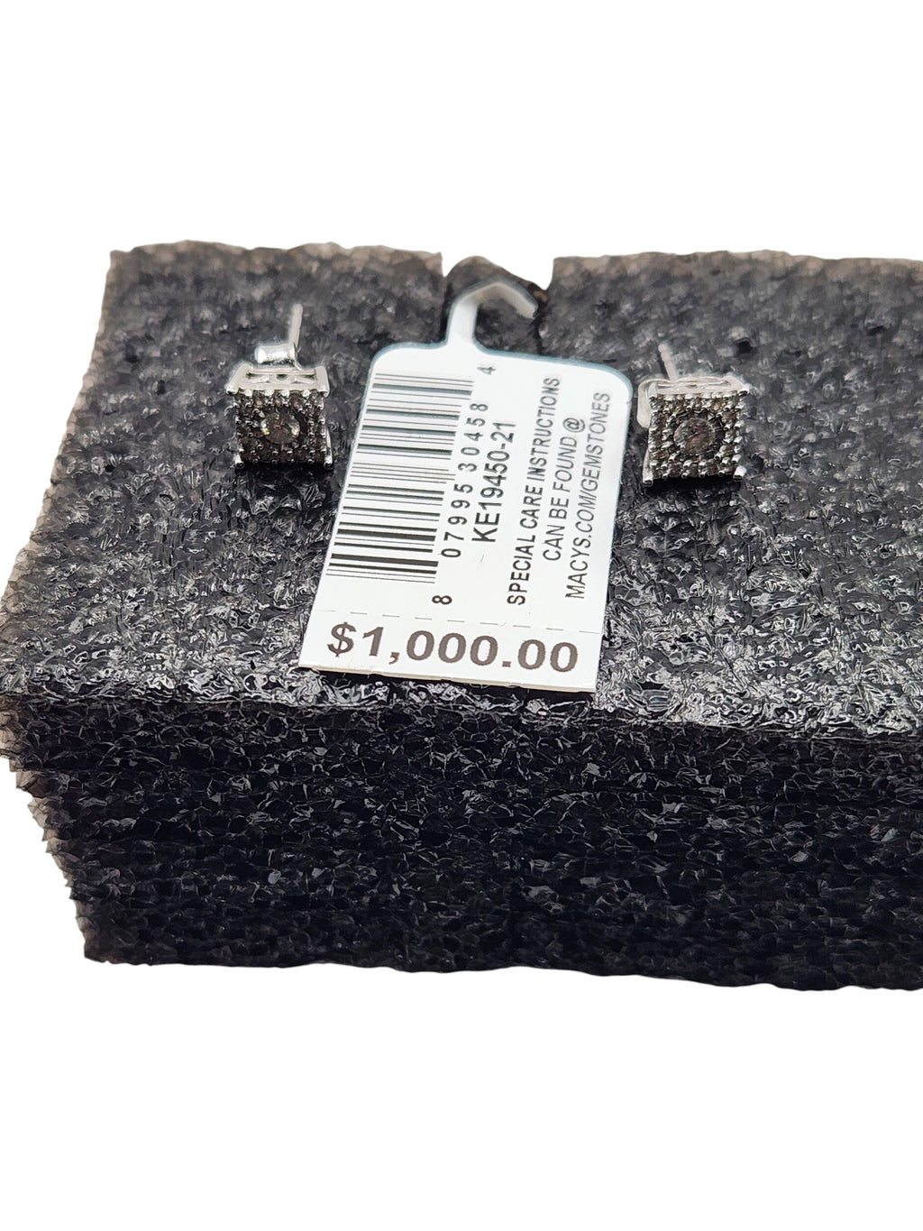 CURATED by Kira 14K white gold halo diamond stud earrings with retail price tag on black foam display
