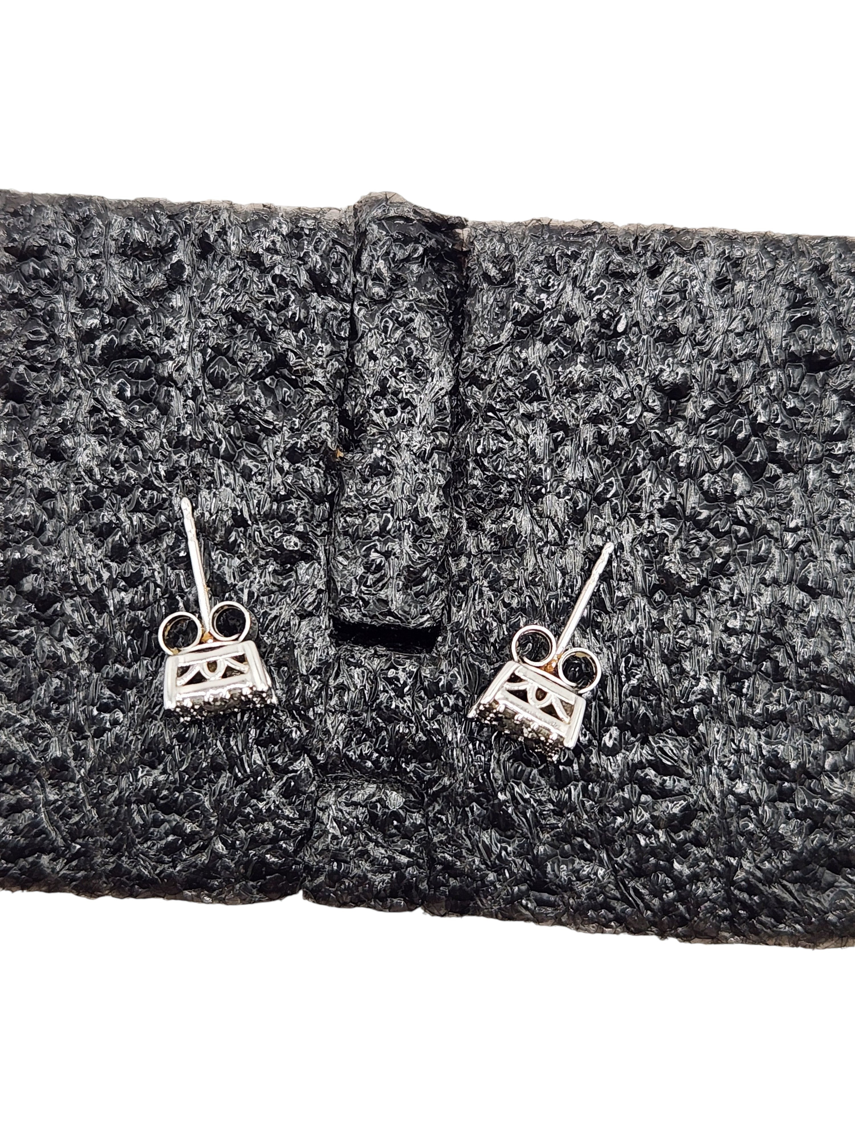 CURATED by Kira 14K white gold halo diamond stud earrings with push-back closures on black textured display