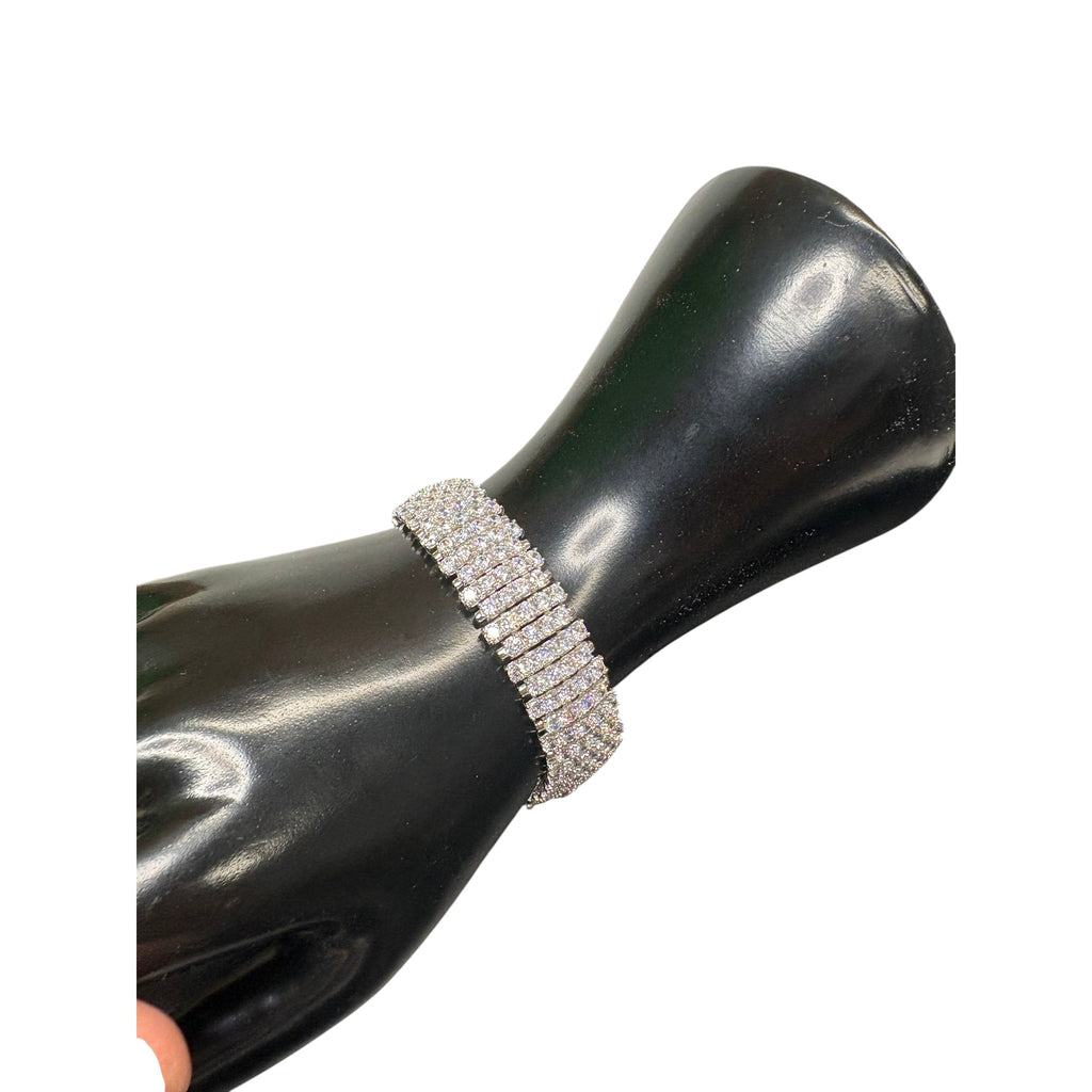 CURATED by Kira wide 5-row sterling silver tennis bracelet featuring sparkling round-cut cubic zirconia stones.