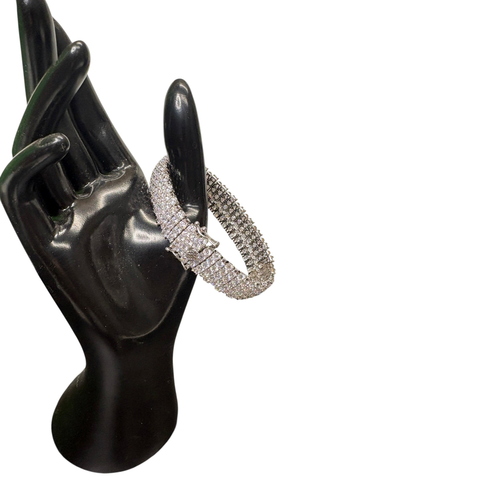 CURATED by Kira wide 5-row sterling silver tennis bracelet featuring round-cut cubic zirconia on a black display hand