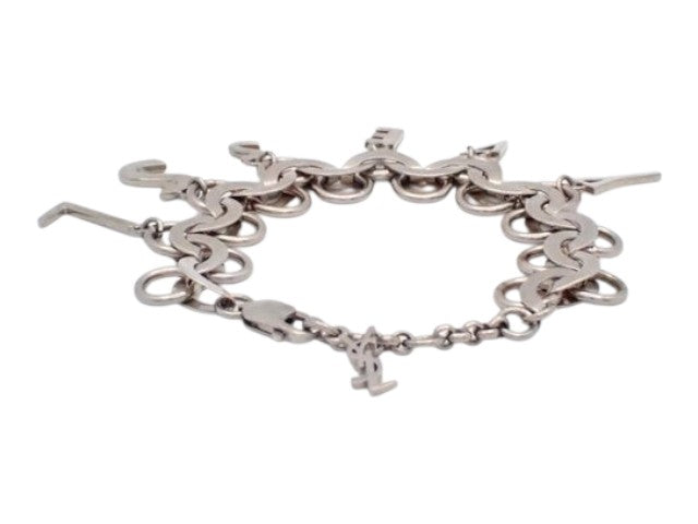 CURATED by Kira silver YSL Cassandra charm swing bracelet with logo links and a lobster clasp closure.