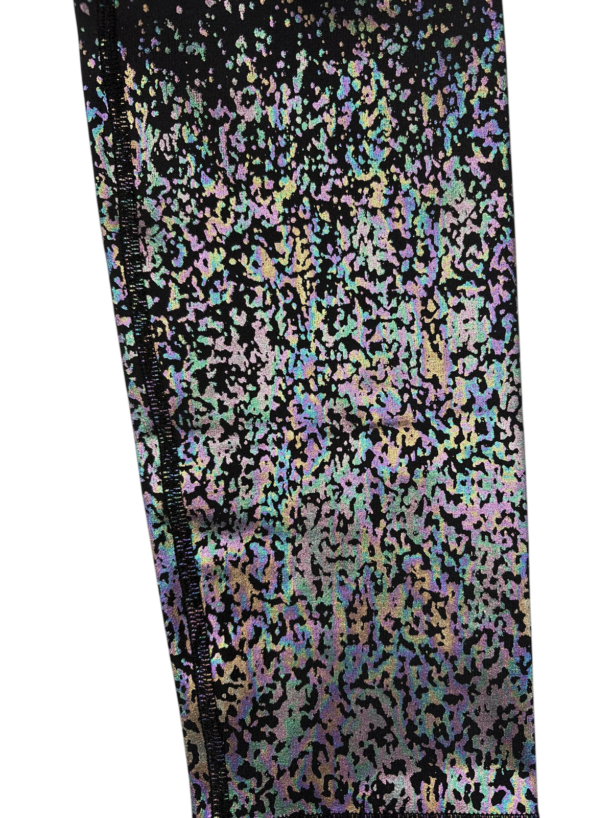 CURATED by Kira ZYIA Active leggings featuring a black fabric with an iridescent metallic reflective speckle pattern.