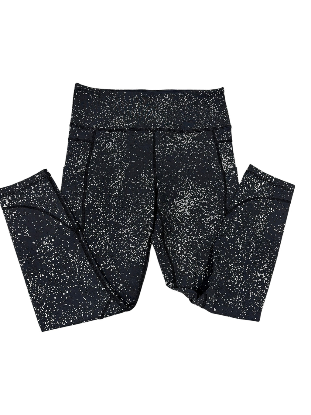 CURATED by Kira Zyia Active black high-rise leggings with silver reflective paint splatter and side pockets.